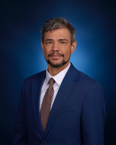 A headshot of the LGBTQ Affairs Commission executive director Henry Sias. 
